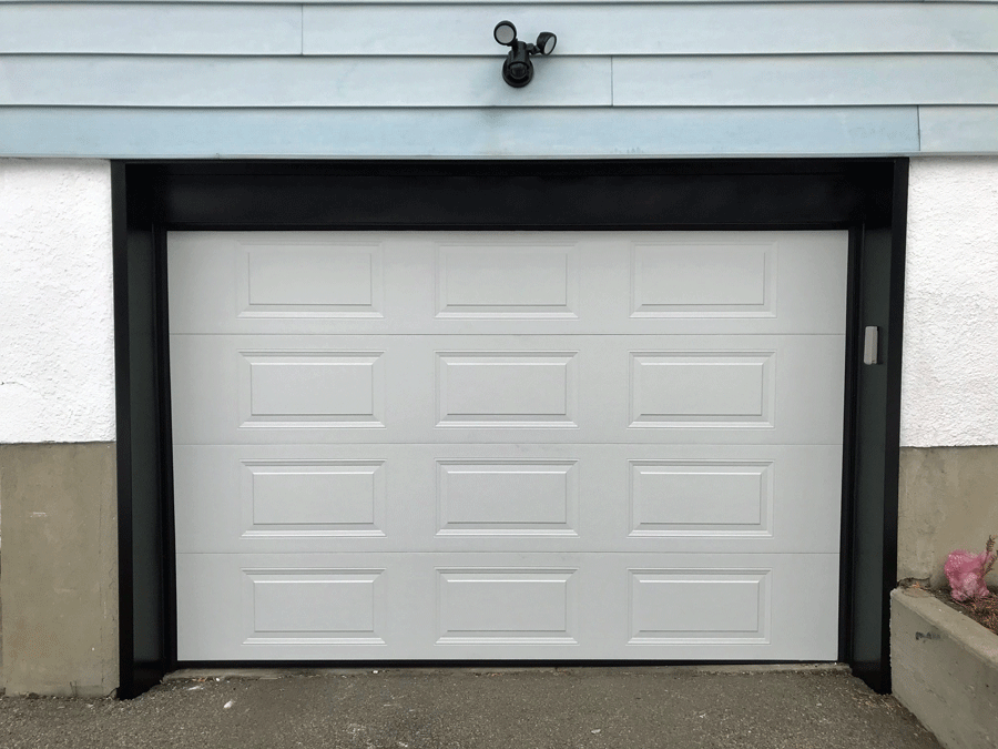 Cladding Around Garage Door in Calgary installed by Glenmore Doors